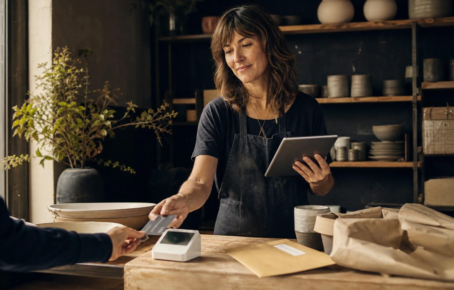 Independent business owner accepting a customer payment